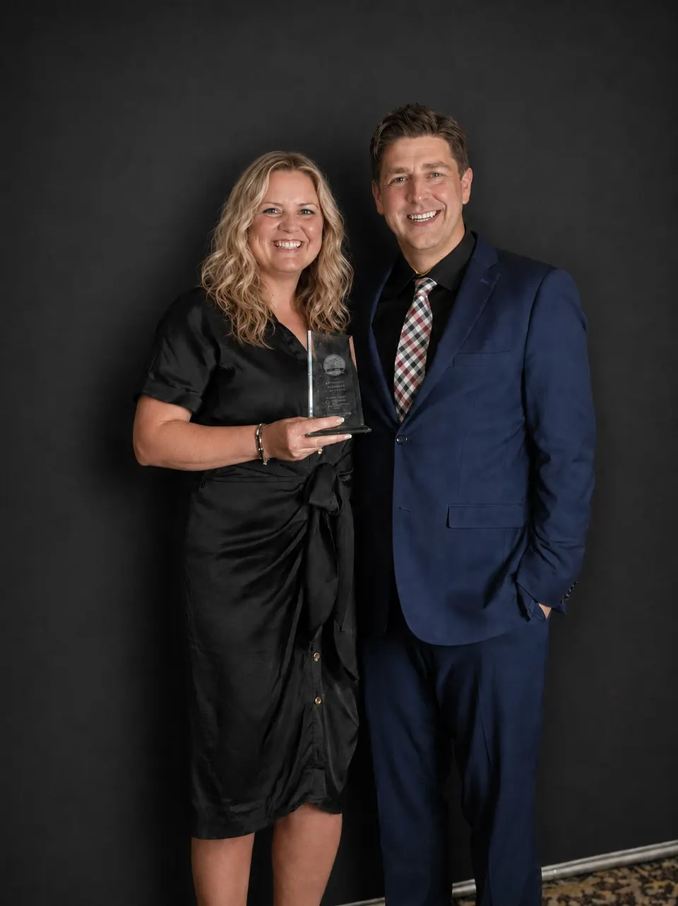 Hopewell’s Chief Executive Officer holding the 2026 Not-for-Profit of the Year award at the gala