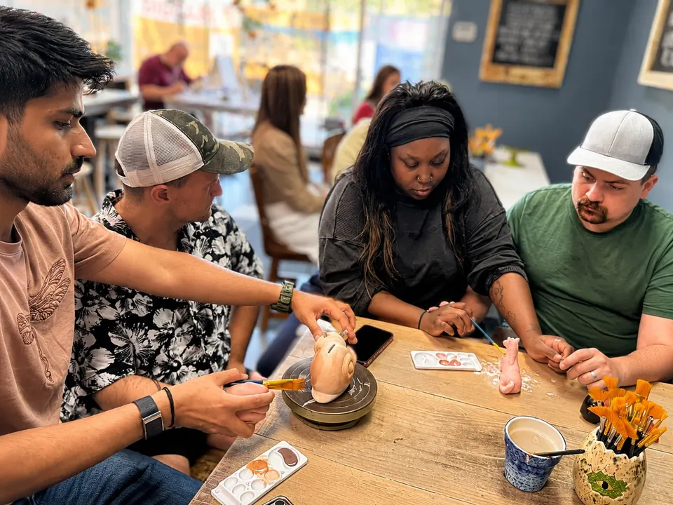 Supported individuals and staff sharing an activity together on a community outing