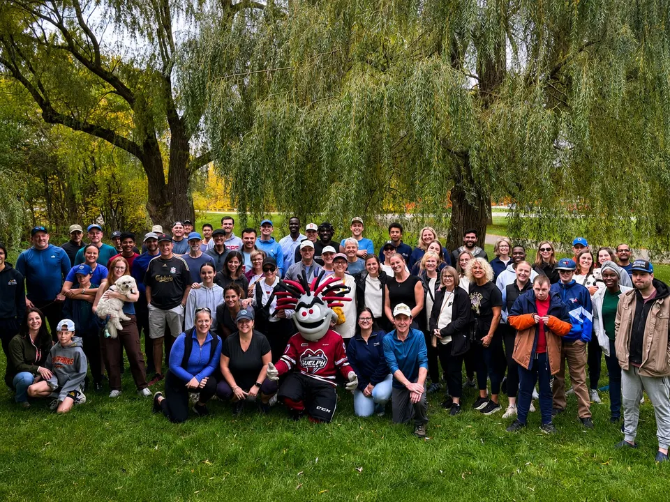 A large group of supporters, staff and supported individuals gathered outdoors at a Hopewell fundraising event